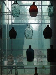 Bottle collection in the museum- love the blue gray light