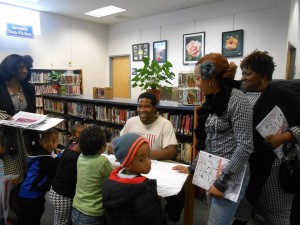 D. Marque signing his coloring books at an event at North Wilmington Branch Library, DE.