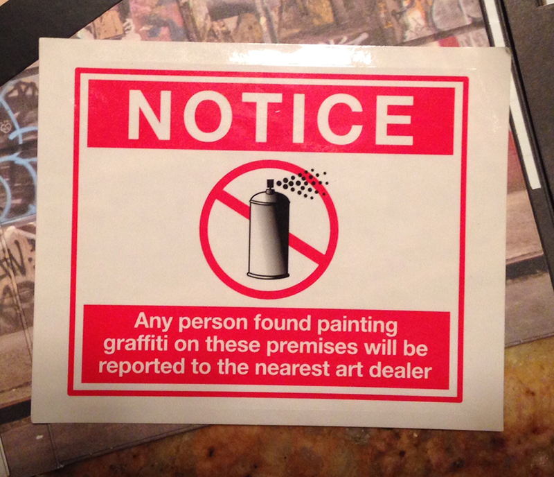 Notice, sticker from DVD Exit Through the Gift Shop